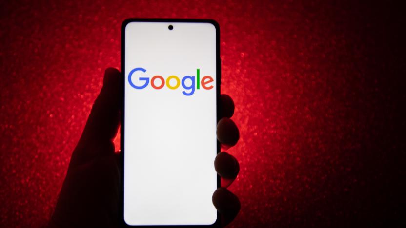 Google logotype on a smartphone held by a hand with a dark red background. Google closeup logo displayed on a phone screen, smartphone the logo or the search engine in various backgrounds like keyboard, dark illuminated texture or a computer screen,  as seen in this multiple exposure illustration, the company's symbol is globally recognized. Google, LLC is an American tech giant, a multinational technology company that specializes in Internet-related services and products, which include online advertising technologies, a search engine, cloud computing, software, and hardware. It is considered one of the Big Four - Big Tech technology companies in the U.S. and globally. Amsterdam, the Netherlands on January 10, 2022 (Photo by Nicolas Economou/NurPhoto via Getty Images)