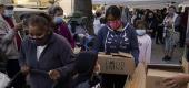 People pick up boxes of groceries at a food bank in Los Angeles. (AP)