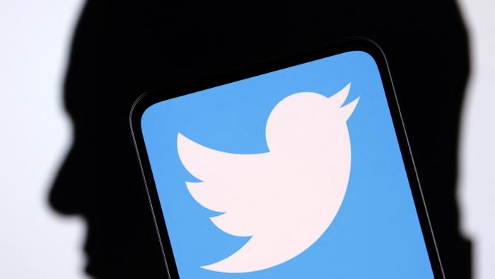 Twitter logo and Elon Musk silhouette are seen in this illustration taken, December 19, 2022. REUTERS/Dado Ruvic/Illustration