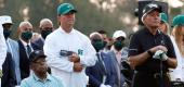 Wayne Player holds a sleeve of golf balls near Lee Elder, left, during the ceremonial tee shots of the Masters. Gary Player is at right. (Reuters)