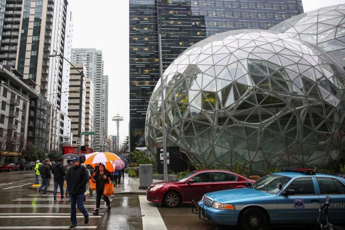 The Amazon Spheres are seen from Lenora Street, the Space Needle in the background, at AmazonÕs Seattle headquarters in Seattle, Washington, U.S., January 29, 2018.    REUTERS/Lindsey Wasson
