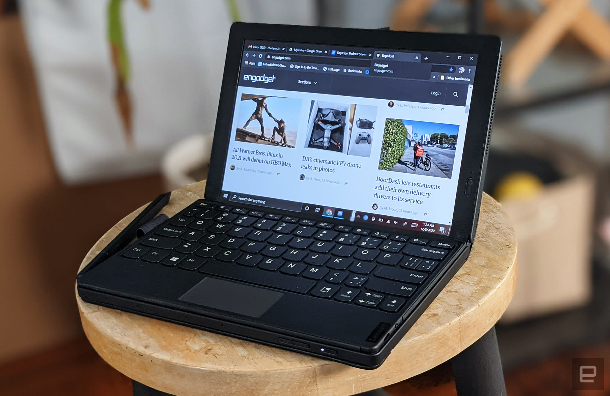ThinkPad X1 Fold tablet/laptop displayed on a stool.