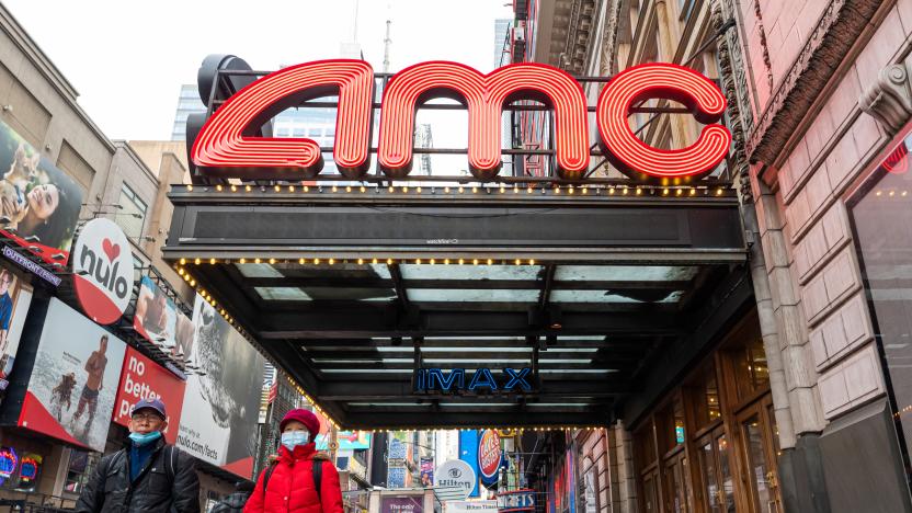 NEW YORK, NEW YORK - DECEMBER 23: People walk outside the AMC Empire 25 movie theater in Times Square as the city continues the re-opening efforts following restrictions imposed to slow the spread of coronavirus on December 23, 2020 in New York City. The pandemic has caused long-term repercussions throughout the tourism and entertainment industries, including temporary and permanent closures of historic and iconic venues, costing the city and businesses billions in revenue. (Photo by Noam Galai/Getty Images)