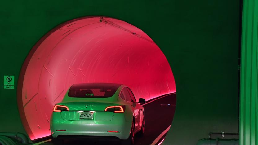 LAS VEGAS, NEVADA - APRIL 09:  A Tesla car drives through a tunnel in the Central Station during a media preview of the Las Vegas Convention Center Loop on April 9, 2021 in Las Vegas, Nevada. The Las Vegas Convention Center Loop is an underground transportation system that is the first commercial project by Elon Musk’s The Boring Company. The USD 52.5 million loop, which includes two one-way vehicle tunnels 40 feet beneath the ground and three passenger stations, will take convention attendees across the 200-acre convention campus for free in all-electric Tesla vehicles in under two minutes. To walk that distance can take upward of 25 minutes. The system is designed to carry 4,400 people per hour using a fleet of 62 vehicles at maximum capacity. It is scheduled to be fully operational in June when the facility plans to host its first large-scale convention since the COVID-19 shutdown. There are plans to expand the system throughout the resort corridor in the future.  (Photo by Ethan Miller/Getty Images)