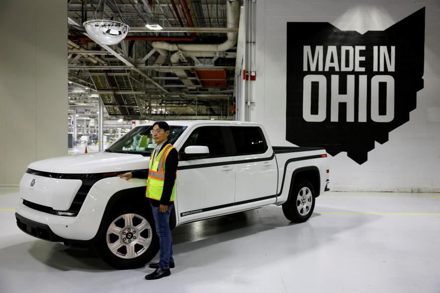 Jerry Hsiao, Chief Product Officer at Foxconn, poses for a photograph next to a finished Lordstown Motors Endurance electric pick-up truck on display at Foxconn's electric vehicle production facility in Lordstown, Ohio, U.S. November 30, 2022. REUTERS/Quinn Glabicki