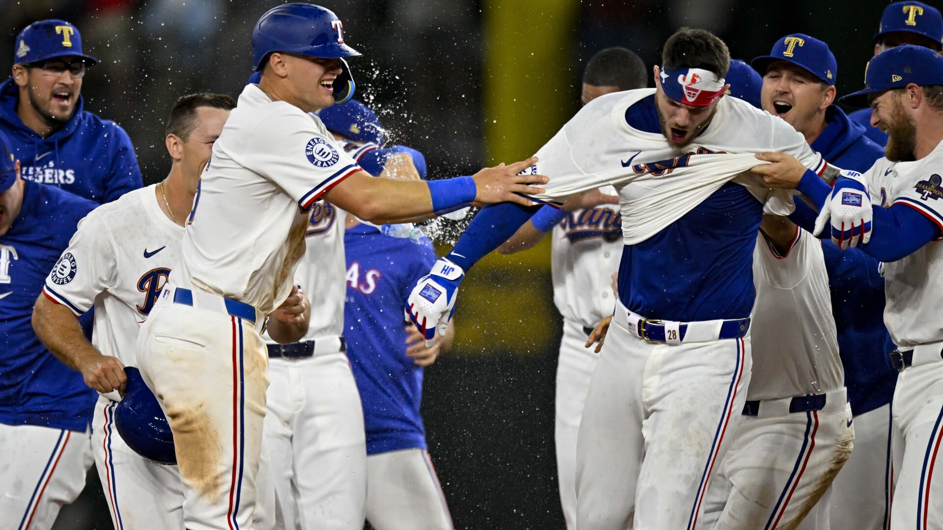 World champion Rangers overcome disputed tip and beat Cubs 4-3 on Heim's 10th-inning single