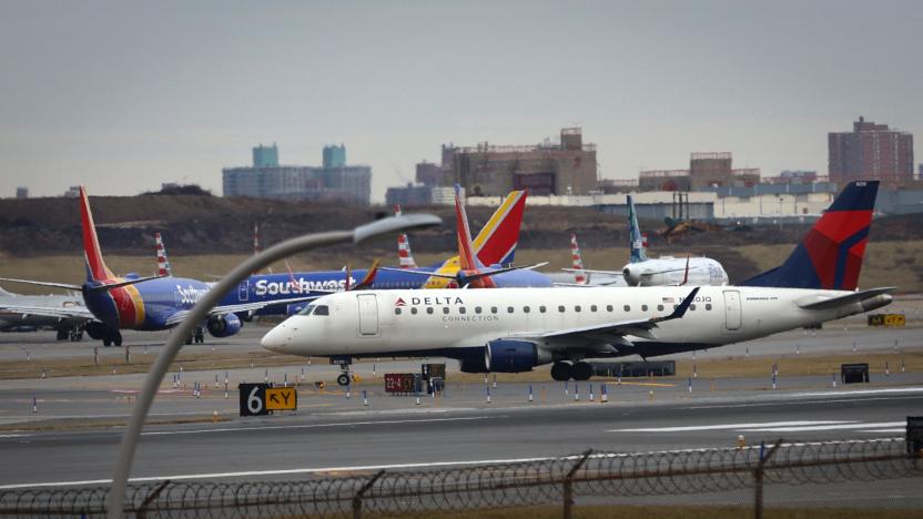 Commercial airplanes are pictured backed up waiting to depart on the runway after flights earlier were grounded during an FAA system outage at Laguardia Airport in New York City, New York, U.S., January 11, 2023. REUTERS/Mike Segar