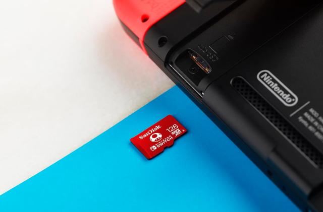 A microSD card sliding into the Switch.