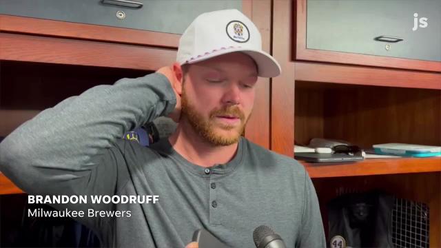 Brandon Woodruff's young daughter joins the Brewers star pitcher in the clubhouse and it's as cute as you'd expect