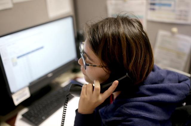 BOSTON, MA - FEBRUARY 28: Sunday, a volunteer at the Samaritans Call Center takes a call at the office in Boston on Feb. 28, 2020. The volunteers answer phone calls from the National Suicide Prevention Lifeline. (Photo by Jonathan Wiggs/The Boston Globe via Getty Images)