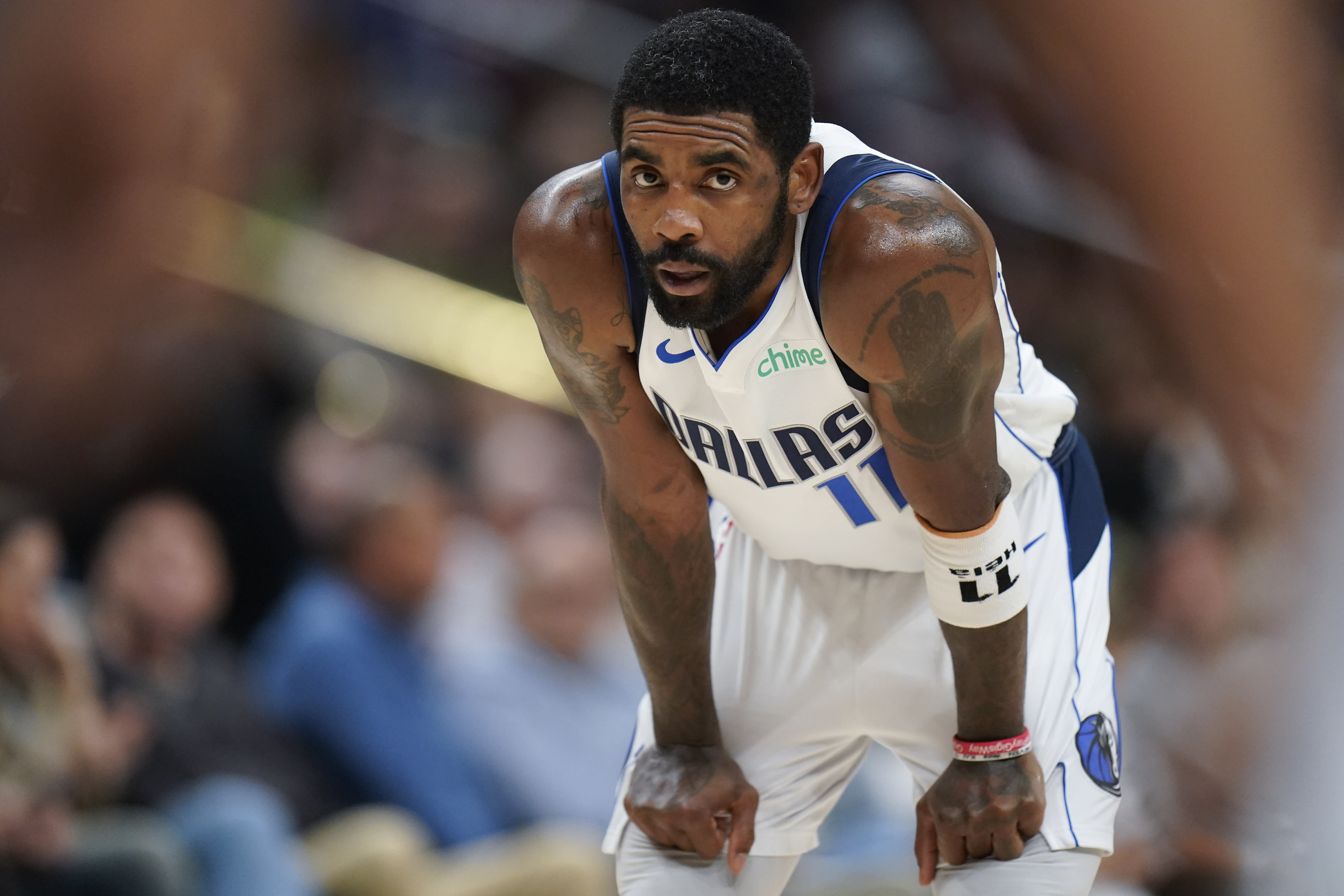 Mavericks guard Kyrie Irving on crutches, wearing walking boot; no timetable for his return