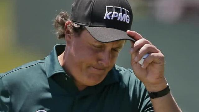 Phil Mickelson snaps and hits a ball before it had stopped rolling