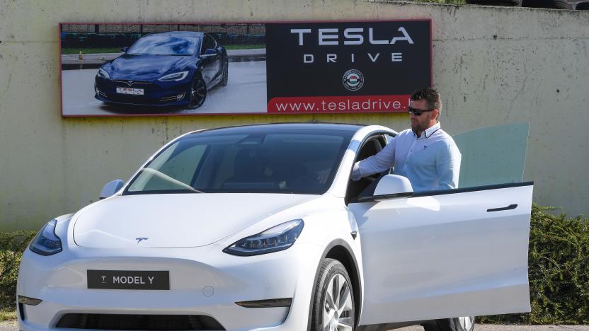 A picture taken on September 5, 2020 shows a driver testing a "Tesla Model Y" car, an all-electric compact SUV by US electric car giant Tesla, during its presentation at the Automobile Club in Budapest. (Photo by ATTILA KISBENEDEK / AFP) (Photo by ATTILA KISBENEDEK/AFP via Getty Images)