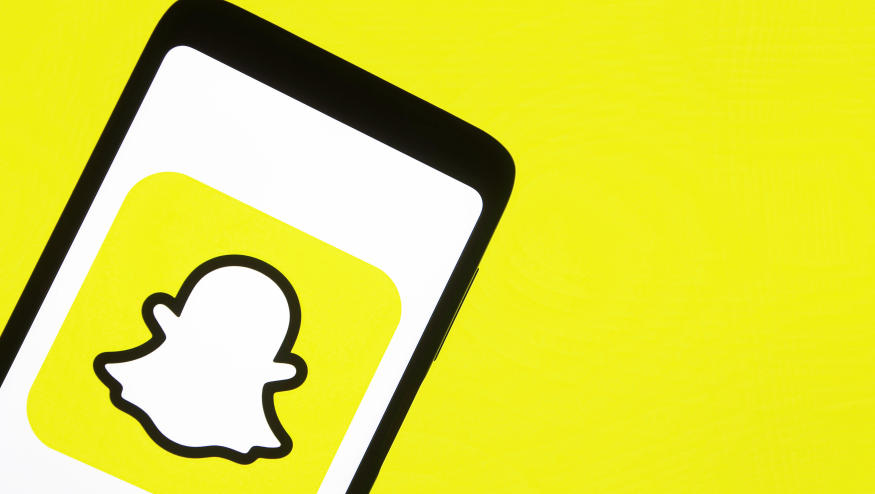 This illustration picture taken on 15 January 2021 shows the Snapchat logo displayed on a smartphone screen (Photo illustration by STR/NurPhoto via Getty Images)