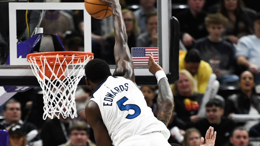 Getty Images - SALT LAKE CITY, UTAH - MARCH 18: Anthony Edwards #5 of the Minnesota Timberwolves dunks over John Collins #20 of the Utah Jazz during the second half of a game at Delta Center on March 18, 2024 in Salt Lake City, Utah. NOTE TO USER: User expressly acknowledges and agrees that, by downloading and or using this photograph, User is consenting to the terms and conditions of the Getty Images License Agreement.  (Photo by Alex Goodlett/Getty Images)