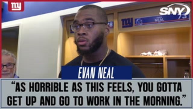New York Giants tackle Evan Neal #73 walks off the field after