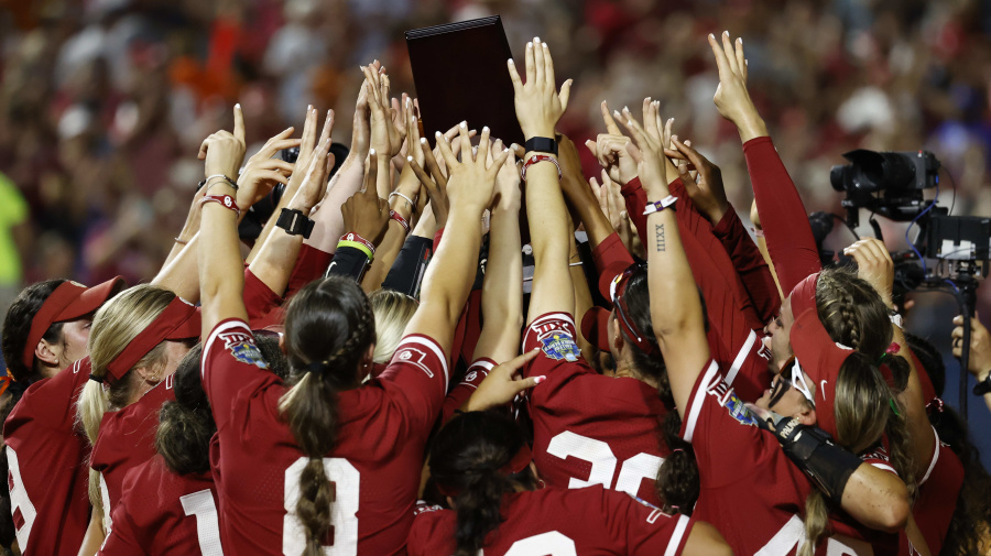 Getty Images - OKLAHOMA CITY, OKLAHOMA - JUNE 06: The Oklahoma Sooners lift the national championship trophy following their 8-4 win over the Texas Longhorns during game two of the Division I Softball Championship held at Devon Park on June 6, 2024 in Oklahoma City, Oklahoma. (Photo by Brendall O'Banon/NCAA Photos via Getty Images)