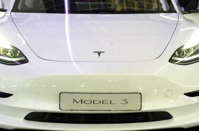 BRUSSELS, BELGIUM - JANUARY 13: The Tesla Logo is seen on a Model 3 during the press opening of the 100th edition of the Brussels Motor Show, in the Heysel Park, on Friday January 13, 2023, in Brussels, Belgium. The 100th edition of the Brussels Motor Show will be the scene of several automobile unveilings, as well as hosting the Car Of The Year election. (Photo by Thierry Monasse/Getty Images)