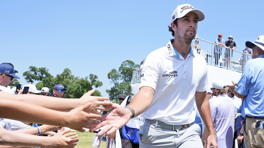 Associated Press - Fans in the gallery reach out to Davis Riley as he walks to the the tenth tee box during the final round of the Charles Schwab Challenge golf tournament at Colonial Country Club in Fort Worth, Texas, Sunday, May 26, 2024. (AP Photo/LM Otero