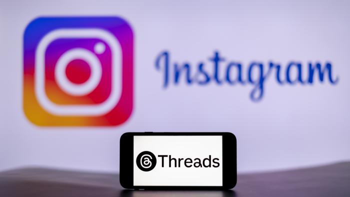 INDIA - 2023/12/15: In this photo illustration, the Threads logo is seen displayed on a mobile phone screen with Instagram logo in the background. (Photo Illustration by Idrees Abbas/SOPA Images/LightRocket via Getty Images)