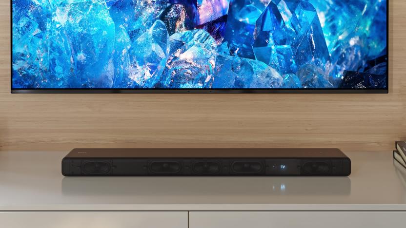 Sony's HT-A3000 soundbar, positioned on a white surface below a wall-hung TV.