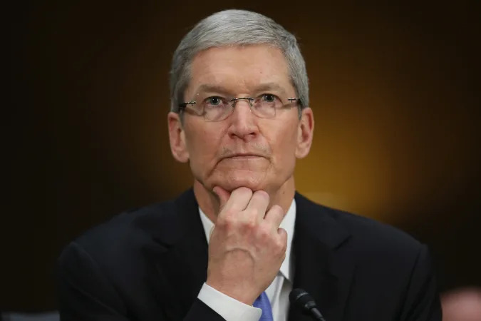 WASHINGTON, DC - MAY 21:  Apple CEO Timothy Cook delivers pauses while giving opening remarks while testifying before the Senate Homeland Security and Governmental Affairs Committee's Investigations Subcommittee about the company's offshore profit shifting and tax avoidance in the Dirksen Senate Office Building on Capitol Hill May 21, 2013 in Washington, DC. A Congressional report released Monday said that Apple, America's most profitable technology company, used a complex system of international subsidiaries and tax avoidance efforts to shift at least $74 billion from the reach of the Internal Revenue Service between 2009 and 2012.  (Photo by Chip Somodevilla/Getty Images)