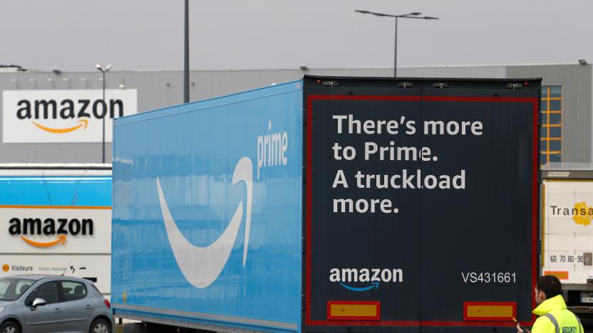 A truck with the logo of Amazon Prime Delivery arrives at the Amazon logistics center in Lauwin-Planque, northern France, March 19, 2020. Several hundred employees protested in France, calling on the U.S. e-commerce giant to halt operations or make it easier for employees to stay away during the coronavirus (COVID-19) epidemic. REUTERS/Pascal Rossignol