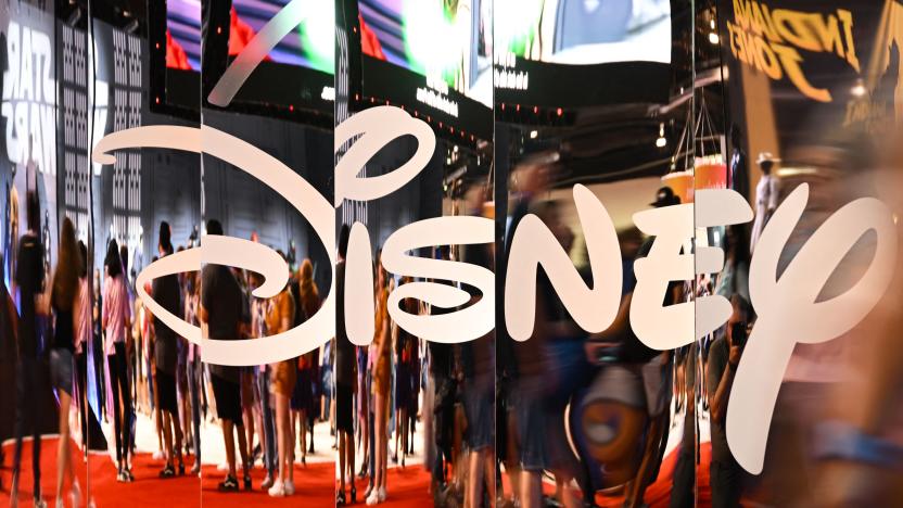 Attendees are reflected in Disney+ logo during the Walt Disney D23 Expo in Anaheim, California on September 9, 2022. (Photo by Patrick T. FALLON / AFP) (Photo by PATRICK T. FALLON/AFP via Getty Images)