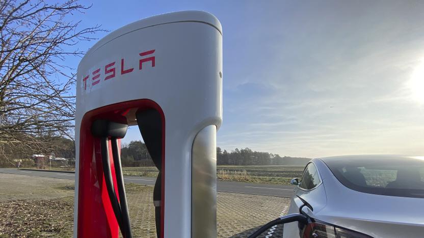 BERSTELAND, GERMANY - MARCH 02: A Tesla Model 3 plugged in and charging at a Supercharger rapid battery charging station for electric vehicles in Bersteland, Germany, on March 02, 2021. (Photo by Thomas Koehler/Photothek via Getty Images)