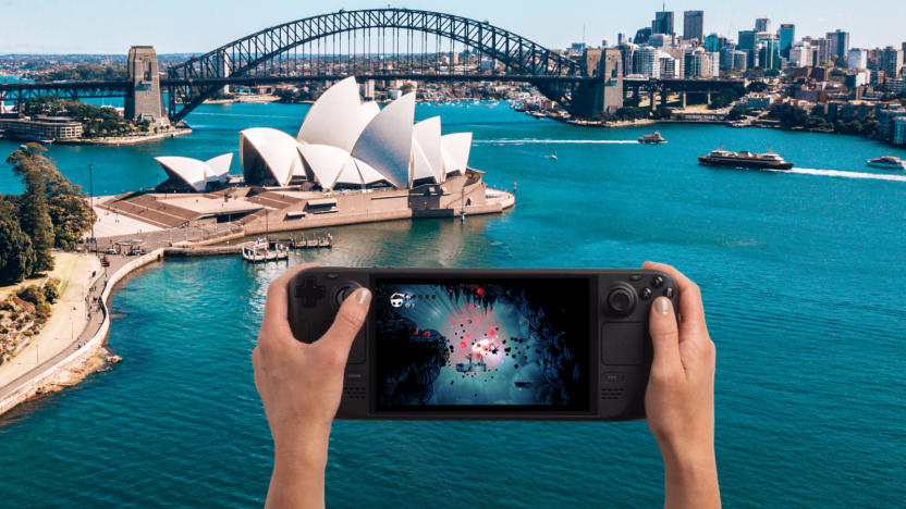 Hands holding a console with the Sydney Opera House in the background.