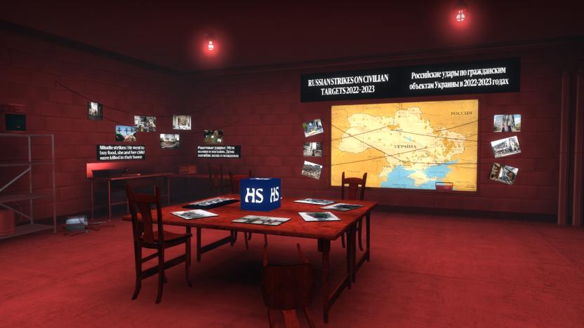Screenshot of a hidden room in the video game ‘Counter-Strike: Global Offensive.’ Red lights hanging from the ceiling cast a blood-red hue. A table lies in the center with a blue  box showing the logo "HS." The walls contain images and text, including the headline "Russian Strikes on Civilian Targets 2022-2023" over a map.