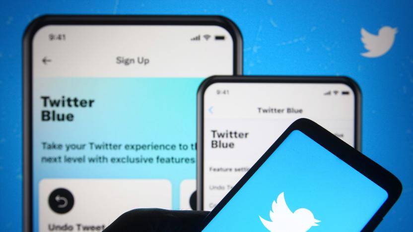 UKRAINE - 2021/06/04: In this photo illustration, Twitter logo is seen on a smartphone in a hand in front of a Twitter webpage about launch new subscription service Twitter Blue. Twitter launches its first subscription service Twitter Blue, reportedly by media. (Photo Illustration by Pavlo Gonchar/SOPA Images/LightRocket via Getty Images)