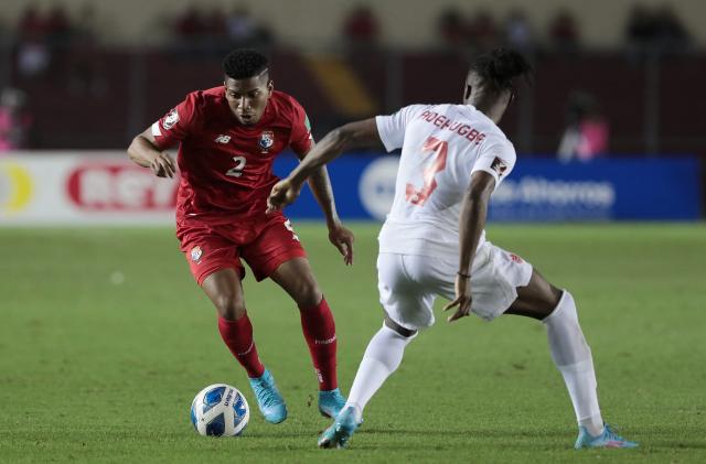 Soccer Football - World Cup - Concacaf Qualifiers - Panama v Canada - Estadio Rommel Fernandez, Panama City, Panama - March 30, 2022 Panama's Cesar Blackman in action with Canada's Sam Adekugbe REUTERS/Erick Marciscano