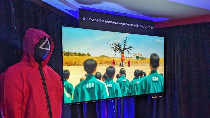 Samsung x Netflix Squid Game In-person pop-up showing a red-suited guard on the left of a TV showing the game.