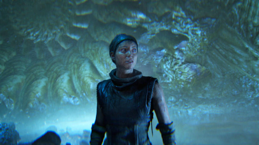 A lone character stands in front of a swirling greenish blue background in this still from the video game Hellblade II.