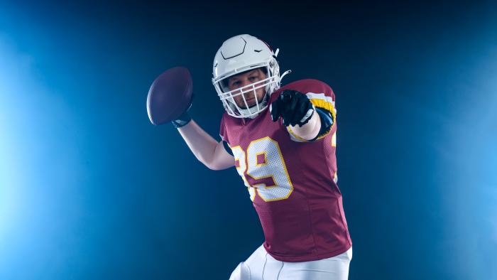 American football player in action. Template for a sports magazine on the theme of American football with copy space. Mockup for betting advertisement.