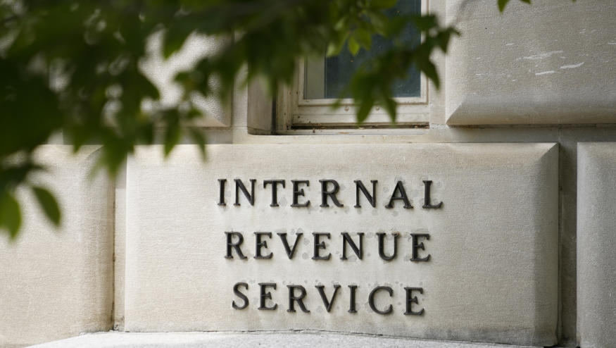 FILE - A sign outside the Internal Revenue Service building in Washington, on May 4, 2021. Most taxpayers will be able to digitally submit a slew of tax documents and other communications to the IRS next filing season and the agency plans to go completely paperless in 2025. (AP Photo/Patrick Semansky, File)