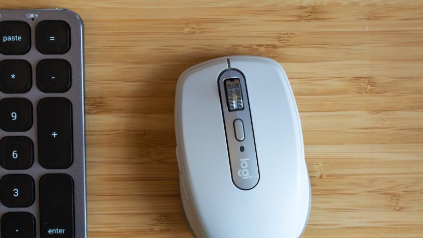 The Logitech MX Anywhere 3 mouse on a wooden table.