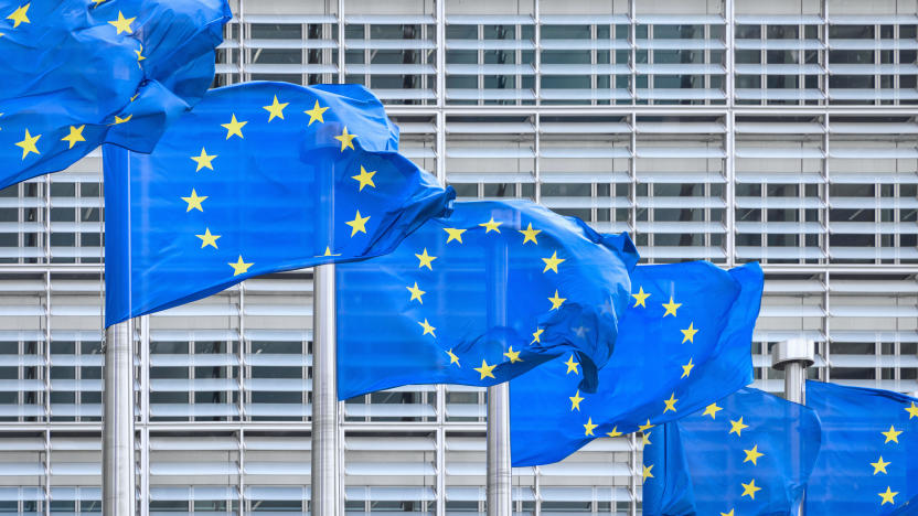 European Union Flag EU Flags side by side in the Wind- European Union Flags in a row in front of the facade of the European Commission Headquarter blowing in the wind. European Commission, Downtown Brussels, Belgium, Europe