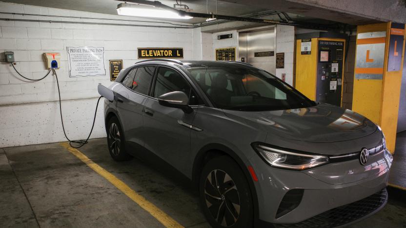 A Volkswagen ID.4 electric vehicle (EV) charges at an EV charging station inside a parking garage owned by the City of Baltimore, in Baltimore, Maryland, U.S., March 23, 2023. REUTERS/Bing Guan