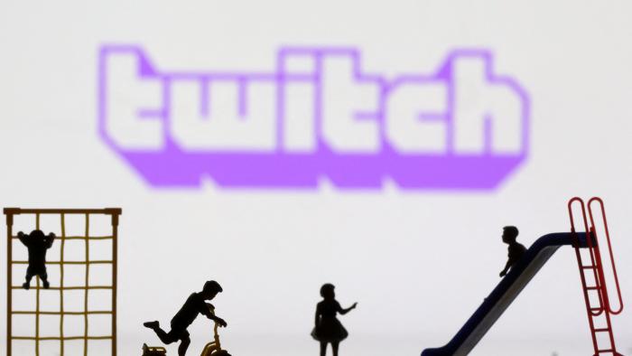 Children playground miniatures are seen in front of displayed Twitch logo in this illustration taken April 4, 2023. REUTERS/Dado Ruvic/Illustration