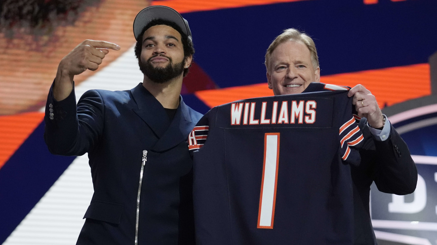 Associated Press - Southern California quarterback Caleb Williams celebrates with NFL commissioner Roger Goodell after being chosen by the Chicago Bears with the first overall pick during the first round of the NFL football draft, Thursday, April 25, 2024, in Detroit. (AP Photo/Jeff Roberson)