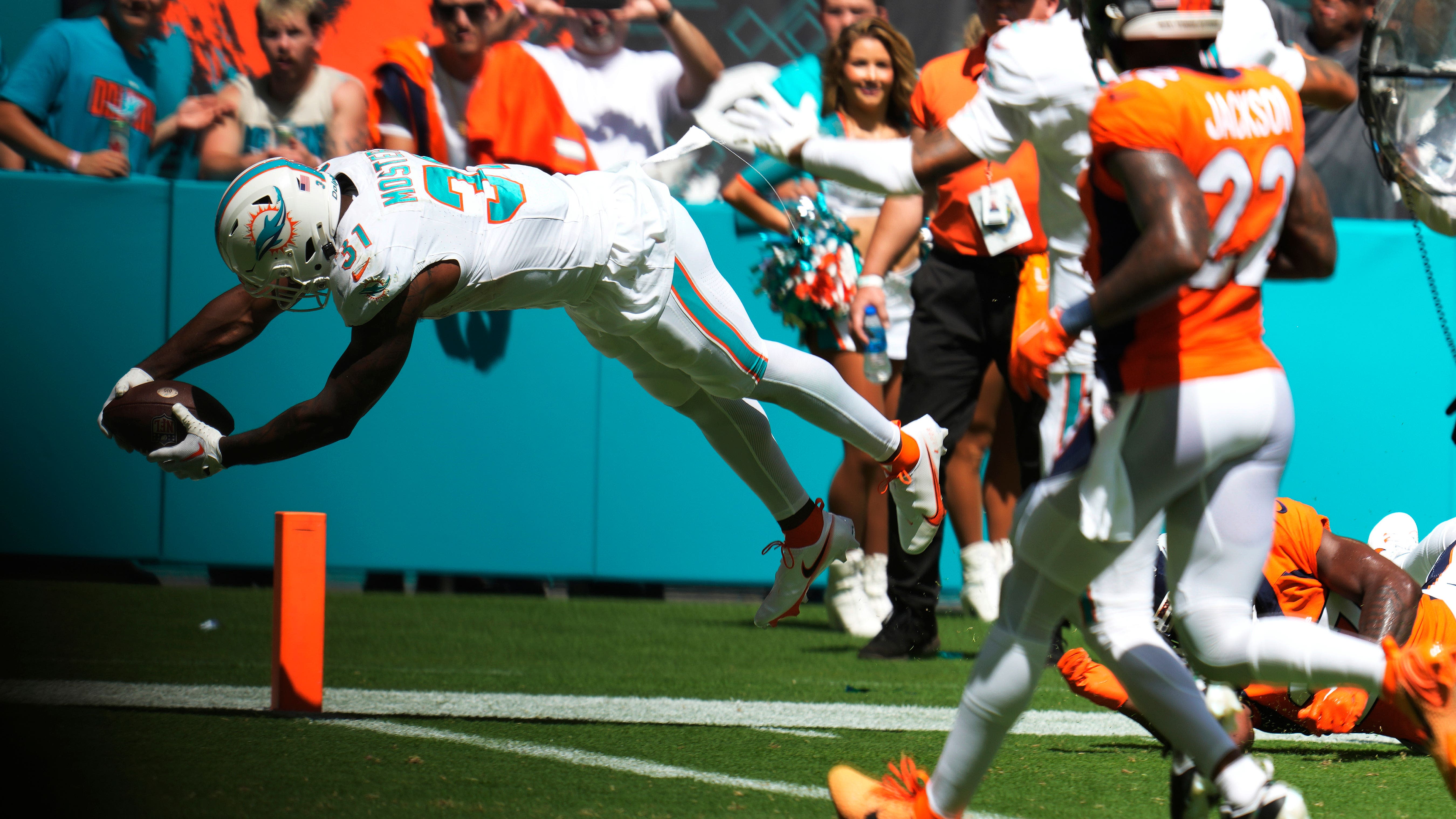 NFL Dolphins destroy Denver 70-20, Bills crush Commanders