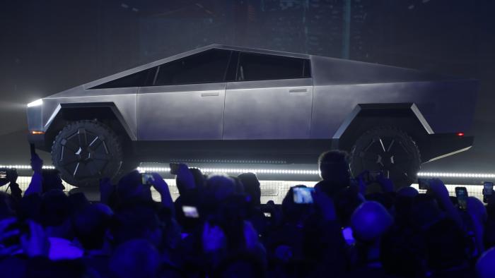 File - The Tesla Cybertruck is unveiled at Tesla's design studio on Nov. 21, 2019, in Hawthorne, Calif. Tesla CEO Elon Musk is expected to give an update on manufacturing problems with long-awaited Cybertruck at an event Thursday marking the first deliveries of the futuristic, angular pickup truck. (AP Photo/Ringo H.W. Chiu, File)