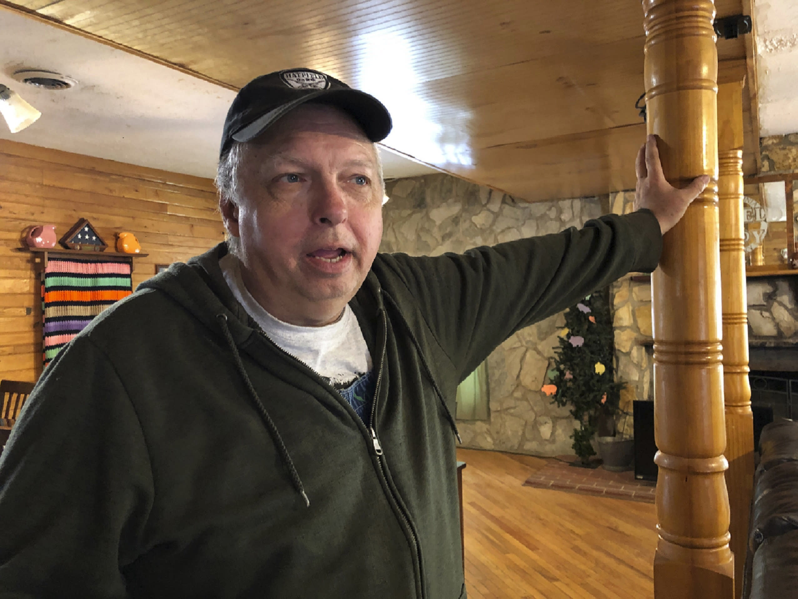 In this Tuesday, May 12, 2020, photo is David Hatfield at the bed and breakfast he owns in Matewan, W.Va. Hatfield is a great nephew of Sid Hatfield, a Matewan police chief who was in a gun battle involving miners and coal company detectives on May 19, 1920. The Matewan Massacre left 10 people dead. (AP Photo/John Raby)