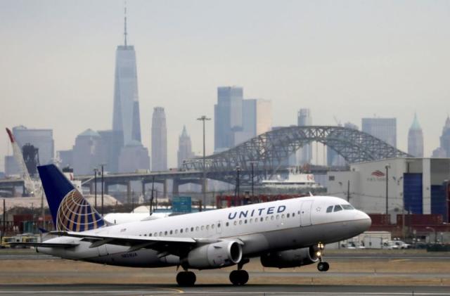 FILE PHOTO: FILE PHOTO: A United Airlines passenger jet takes off with New York City as a backdrop