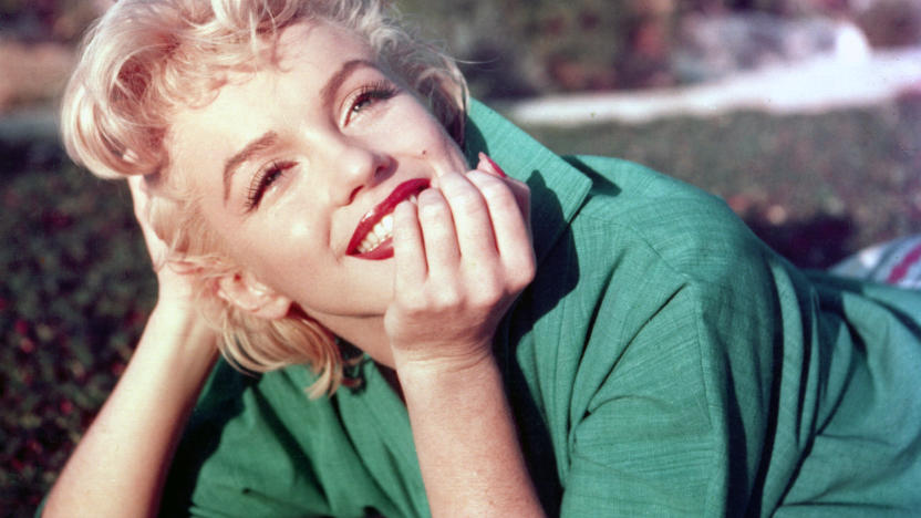 PALM SPRINGS, CA - 1954: Actress Marilyn Monroe poses for a portrait laying on the grass in 1954 in Palm Springs, California. (Photo by Baron/Getty Images)