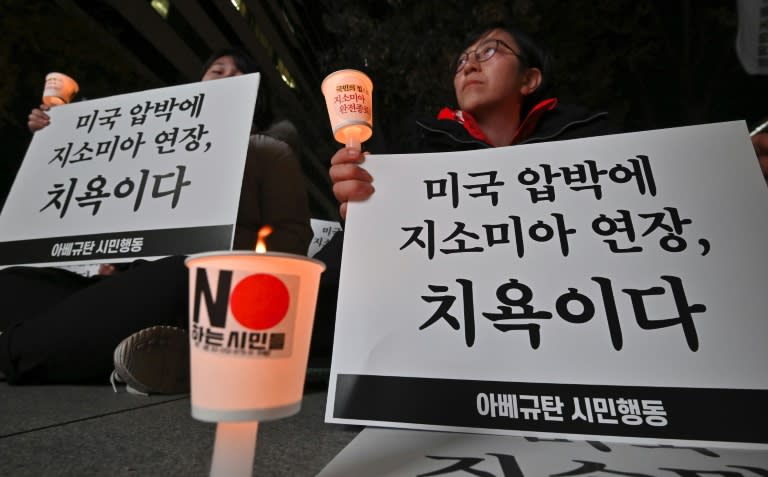 South Korea salvages military pact with Japan at 11th hour