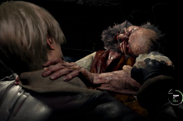 A close-up shot of an infected, bloody villager attacking Leon, the protagonist of Resident Evil 4.