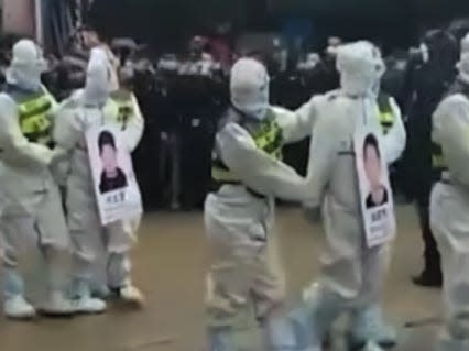 Video captured Chinese authorities publicly shaming 4 alleged smugglers by parading them through city streets